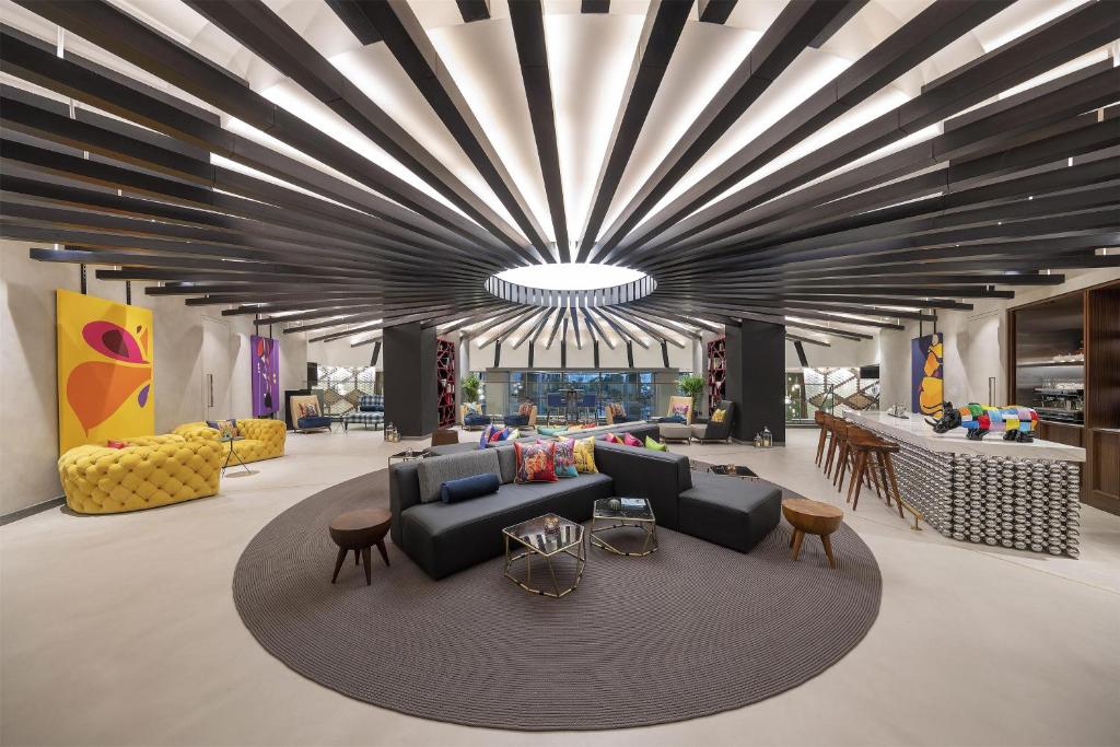 Andaz Dubai The Palm modern lobby with artistic decor.