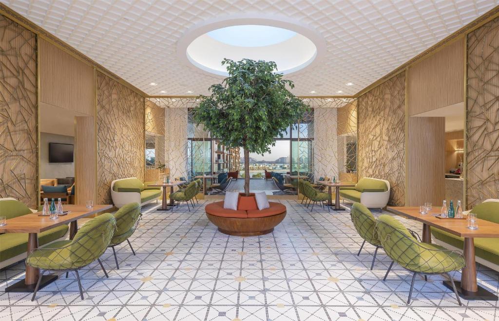 Andaz Dubai The Palm modern lounge area with greenery.