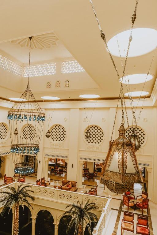 Elegant chandeliers in Baron Palms Resort atrium, showcasing a luxurious atmosphere.