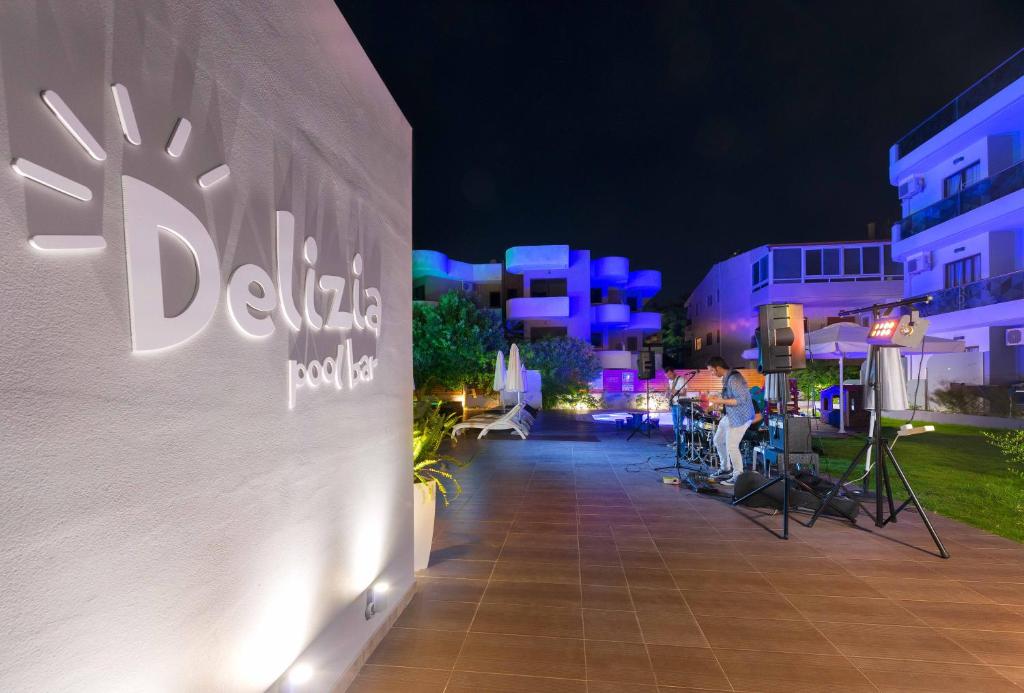 Delizija pool bar at night with live music performance, Sunny Days Hotel-Apartments
