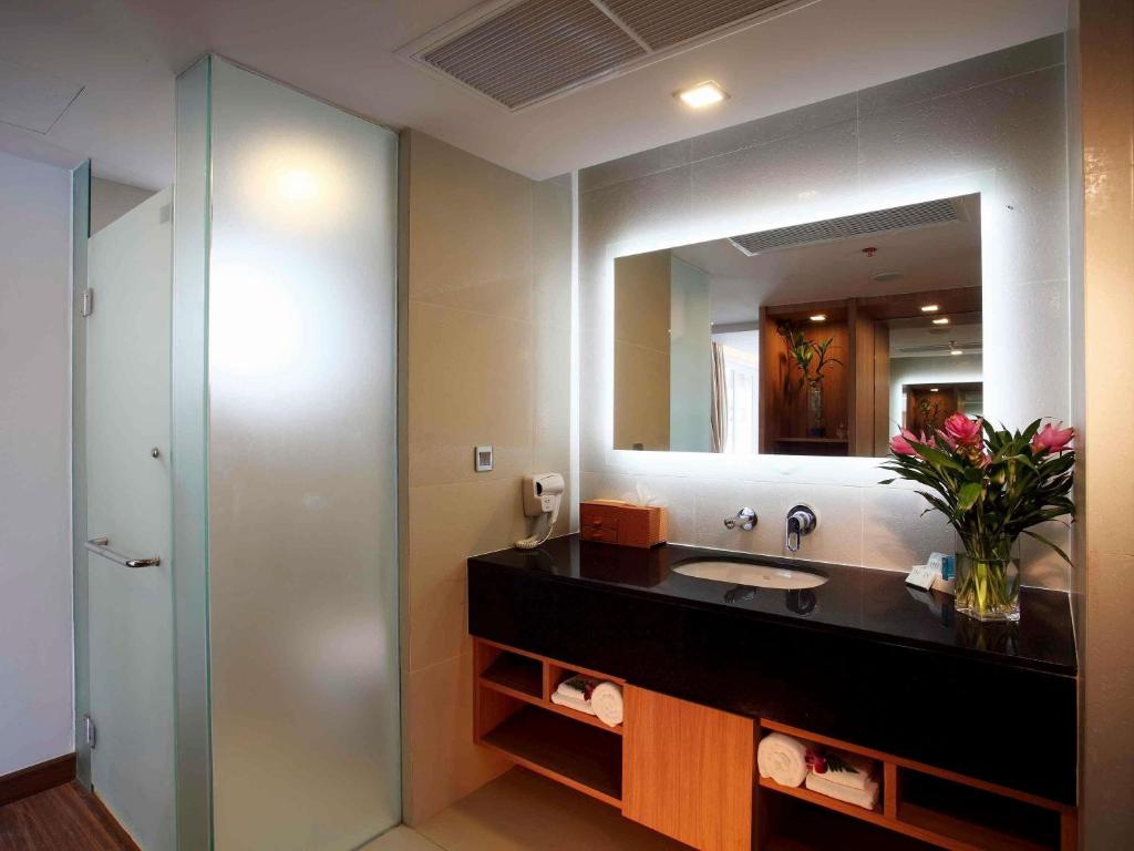 Modern bathroom at Novotel Phuket Kamala Beach with sleek design.
