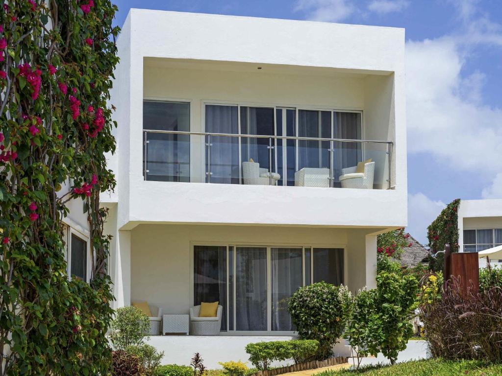 Nungwi Dreams by Mantis viesnīcas balkons ar skatu uz dārzu