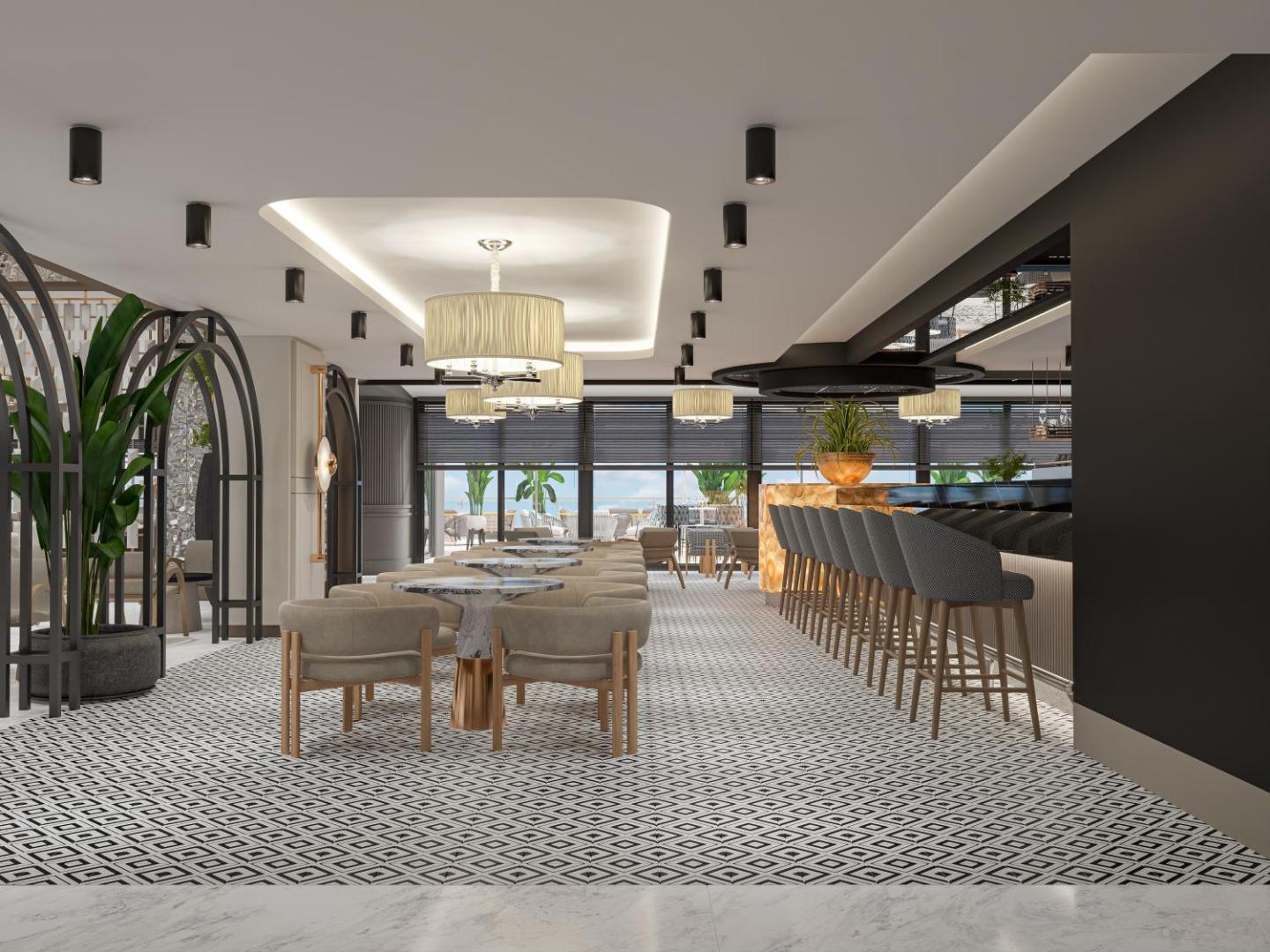 Elegants Annabella Diamond Hotel bārs un atpūtas telpa ar modernu dizainu, mīkstiem krēsliem un stilīgu apgaismojumu
