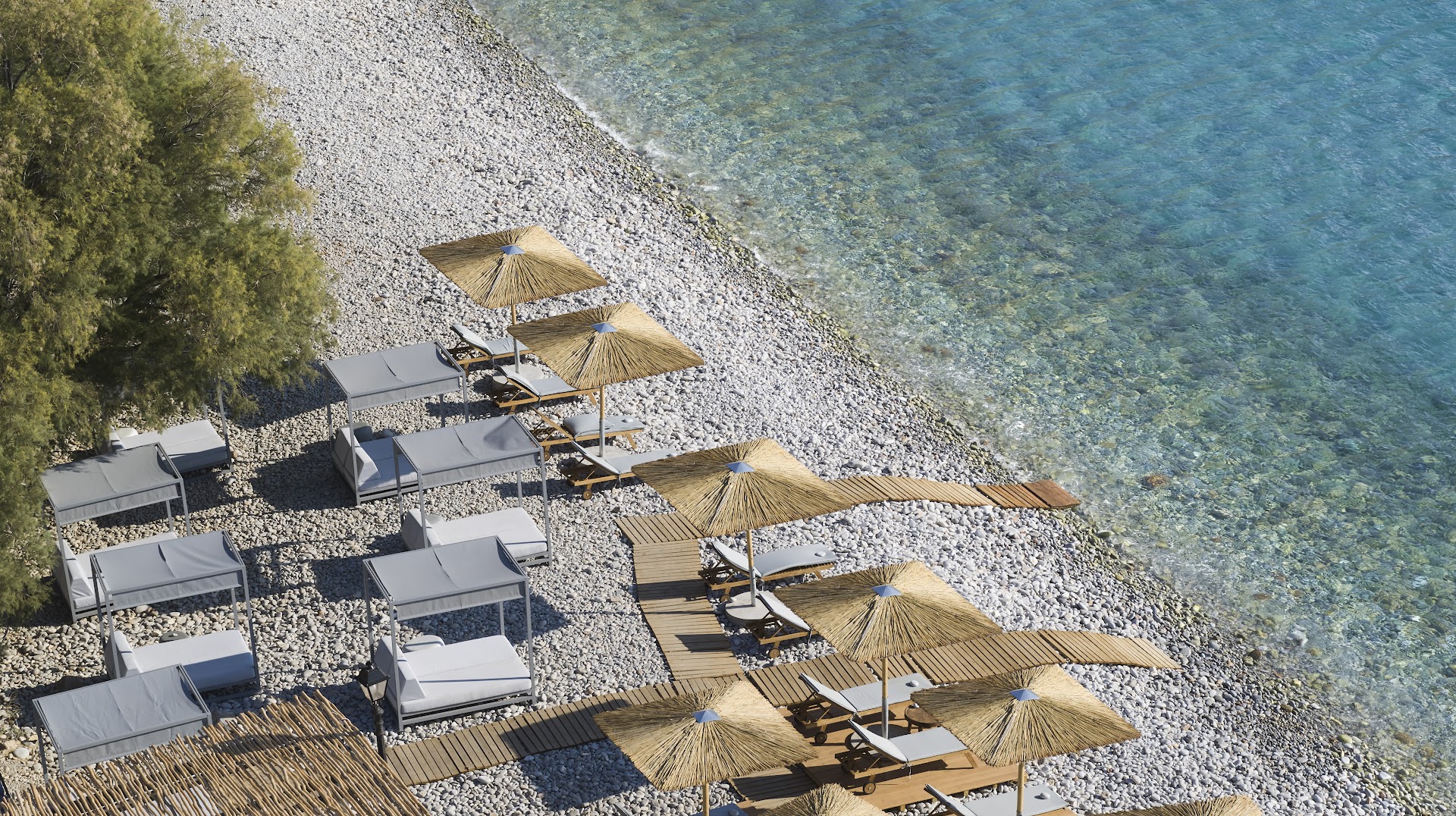 Cayo Exclusive Resort and Spa privātā oļu pludmale ar saulessargiem, sauļošanās gultām un kristāldzidru ūdeni no augšas