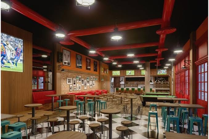 Bahia Principe Fantasia Tenerife plaša atpūtas zona ar biljarda galdiem, augstajiem krēsliem un sporta bāra atmosfēru Tenerifē.