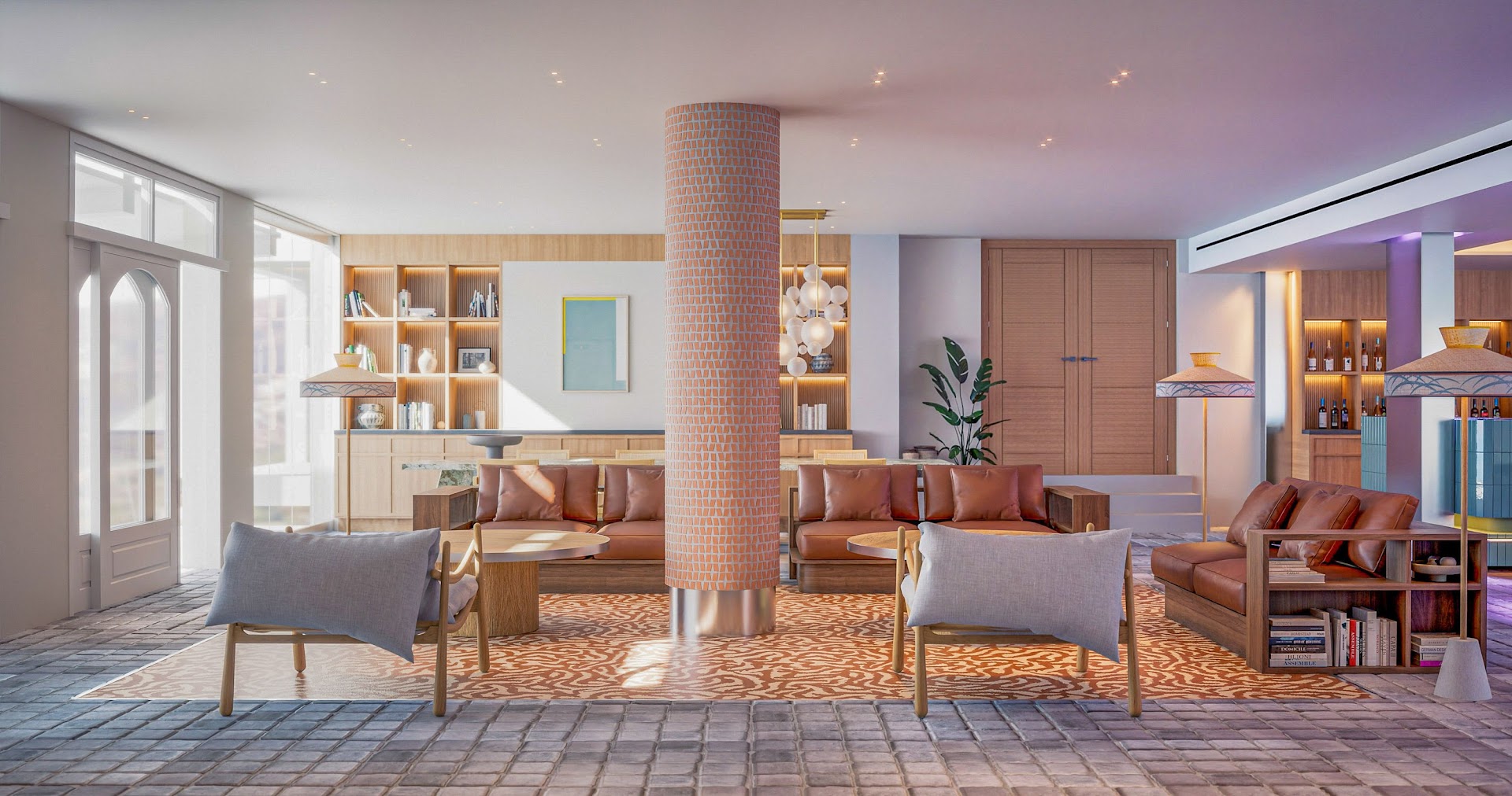 INNSiDE by Meliá Elounda lobby atpūtas zona ar ādas dīvāniem, dizaina lampām un grāmatu plauktiem