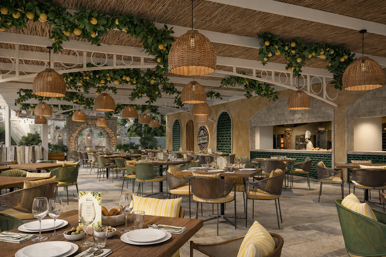 Baska Resort Bodrum restorāna zāle ar atvērto virtuvi, dzelteniem akcentiem mēbelēs un dekoratīviem citroniem pie griestiem