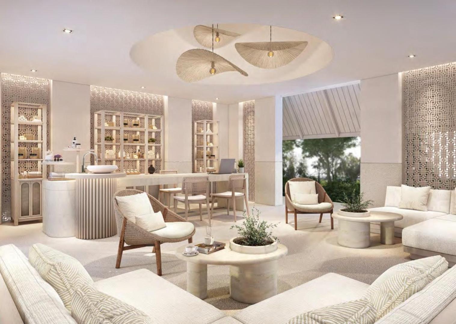 Centara Karon Resort Phuket modernā spa centra recepcija un atpūtas telpa ar gaišām mēbelēm un dizaina gaismekļiem