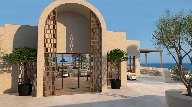 Nana Royal Premium Resort restorāna vai atpūtas zonas ieeja ar arkām un skatu uz jūru — gaišs, moderns dizains