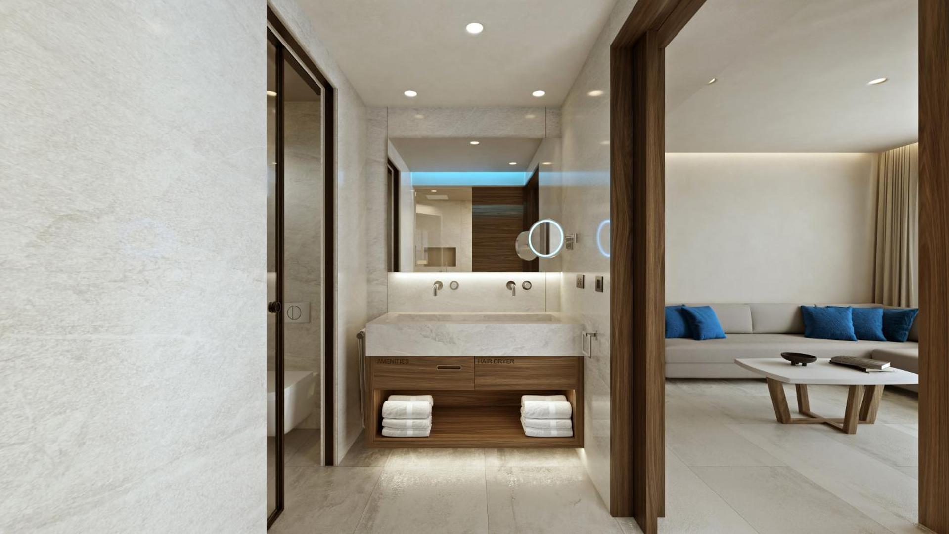 Nana Royal Premium Resort luksusa numura vannas istaba ar marmora apdari, koka akcentiem un skatu uz dzīvojamo zonu