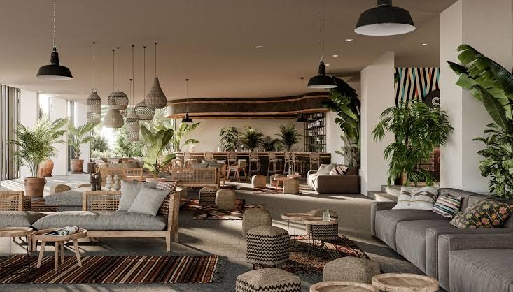 Plašs Cook's Club Corfu viesnīcas lobby bārs un koplietošanas telpa ar modernām mēbelēm, telpaugiem un dizaina elementiem